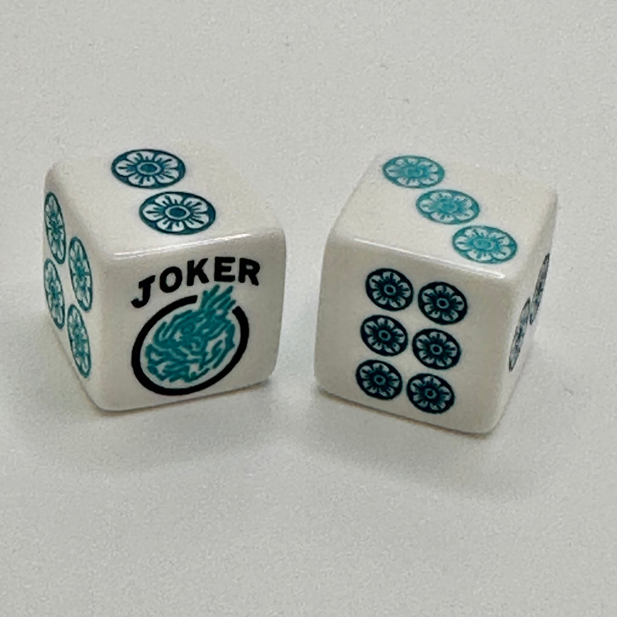 One Joker Away - one pair of white 19mm size dice with turquoise and teal blue