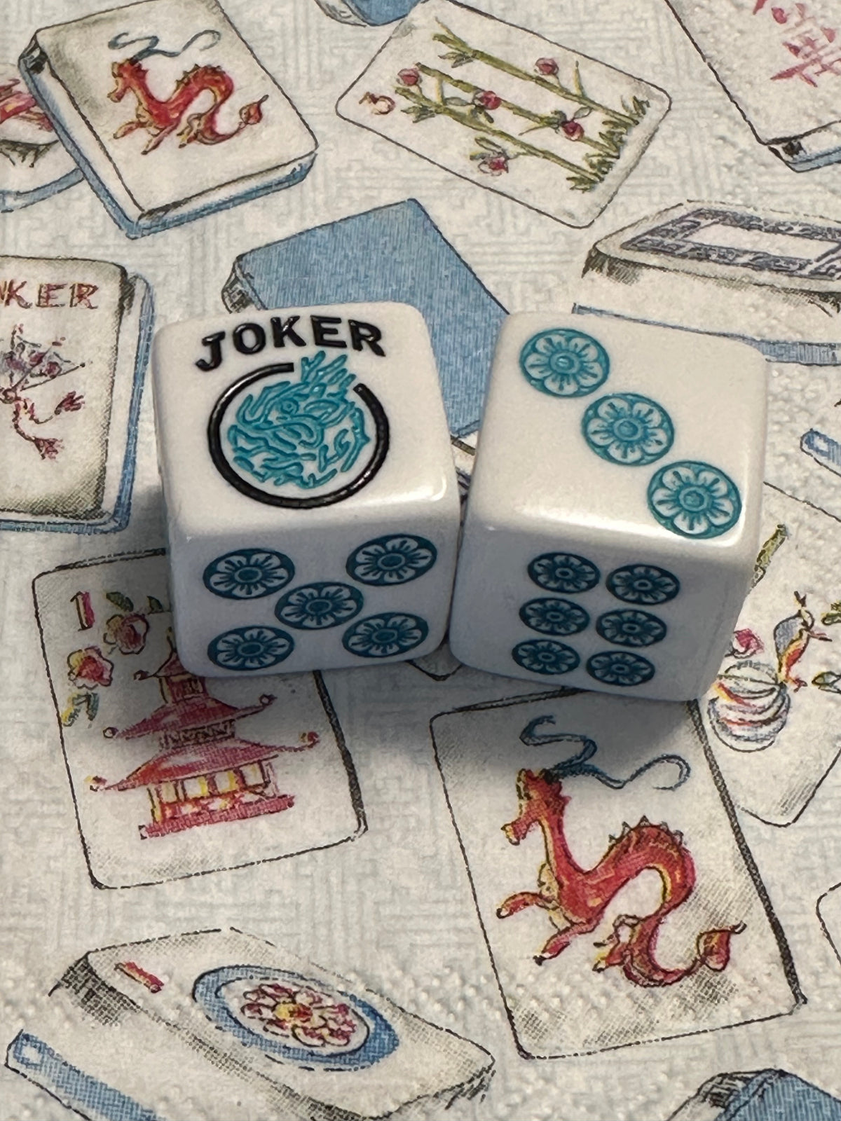 One Joker Away - one pair of white 19mm size dice with turquoise and teal blue
