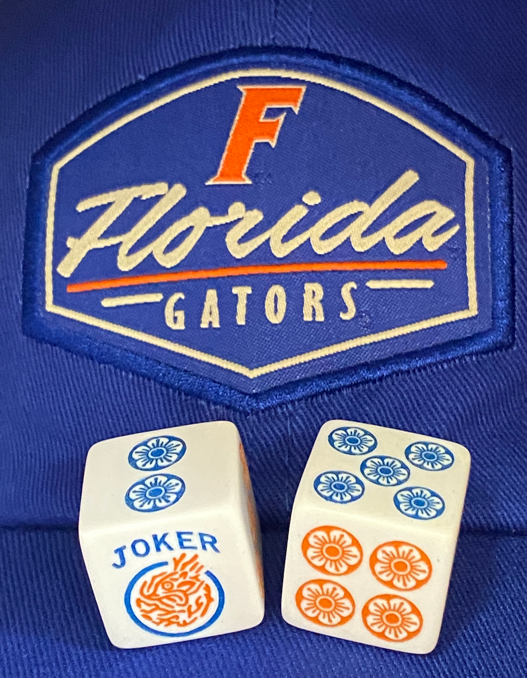 Team Spirit Collection - One pair of Orange and Blue Joker Mahjong Dice™. Orange & Blue