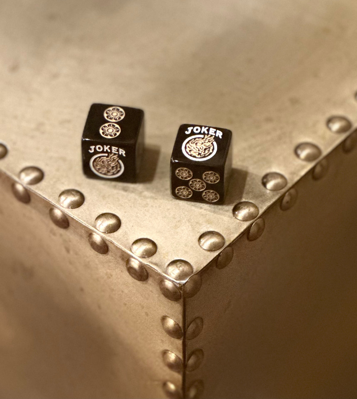 One Joker Away - one pair of black 19mm size dice with gold and silver