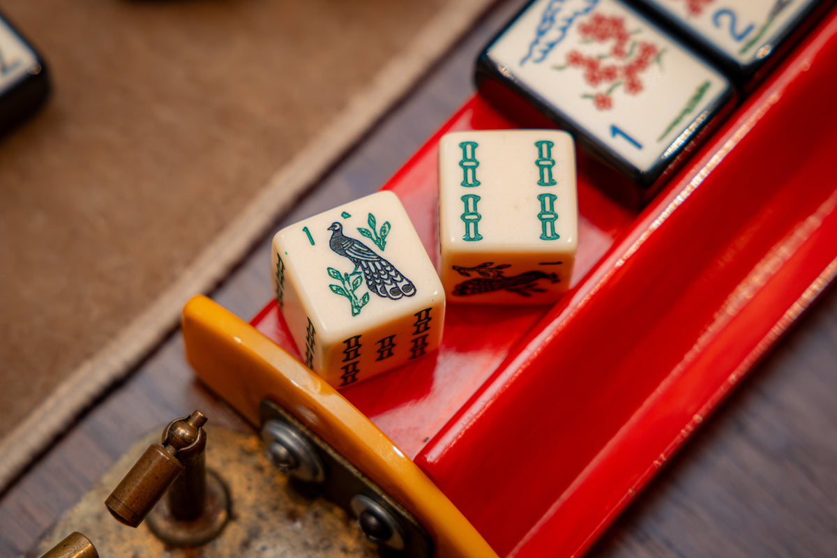 The Prestigious Peacock - one pair of standard size 19mm ivory dice with peacock and bam designs